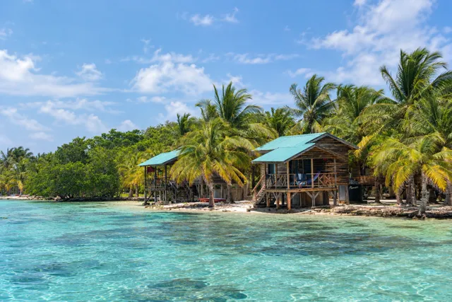 Island waterfront and wooden buildings seen from the sea